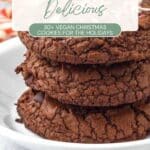 A stack of chocolate cookies on a white plate, with the text "Dairy-Free and Delicious: 30+ Vegan Christmas Cookies for the Holidays" above.