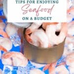 Image of shrimp with ice cubes and a can. Text overlay reads: "13 Tips for Enjoying Seafood on a Budget" with the website sagealphagal.com at the bottom.