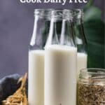 Three glass bottles of plant-based milk and a jar of oats on a tray, with text: "Simple Swaps to Cook Dairy Free" at the top.