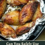 Cooked chicken wings on foil in an air fryer, with text asking about the safety of using foil in air fryers.