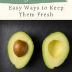 Halved avocado on a dark surface with text: "Storing Avocados - Easy Ways to Keep Them Fresh" and "SageAlphaGal.com.