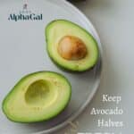 Two avocado halves on a plate, one with a pit, the other without. Text reads, "Keep Avocado Halves Fresh Without Browning" with "Sage AlphaGal" logo above.