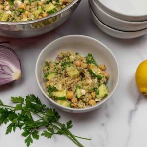 A bowl of Jennifer Aniston's famous quinoa salad with lemon and parsley.