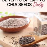 A wooden spoon with chia seeds, a wooden bowl filled with chia seeds, and a glass jar of chia seeds on a wooden board, promoting the daily nutritional benefits of eating chia seeds.