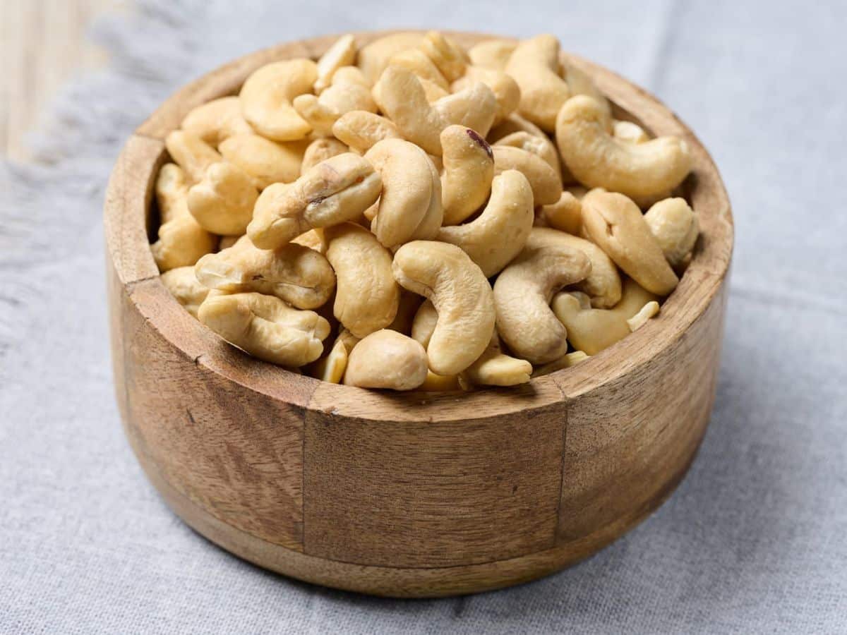 Cashew nuts in a wooden bowl.