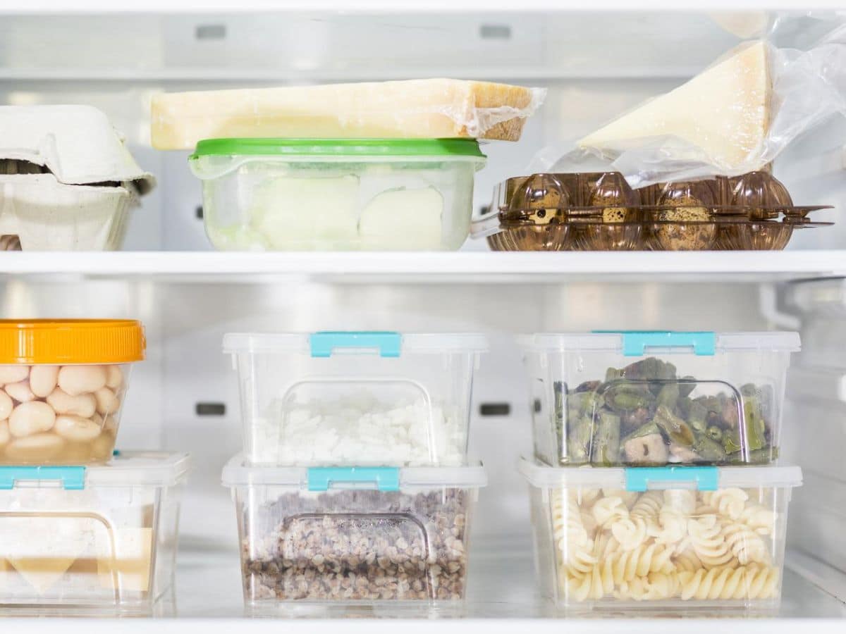 A refrigerator full of food in plastic containers.