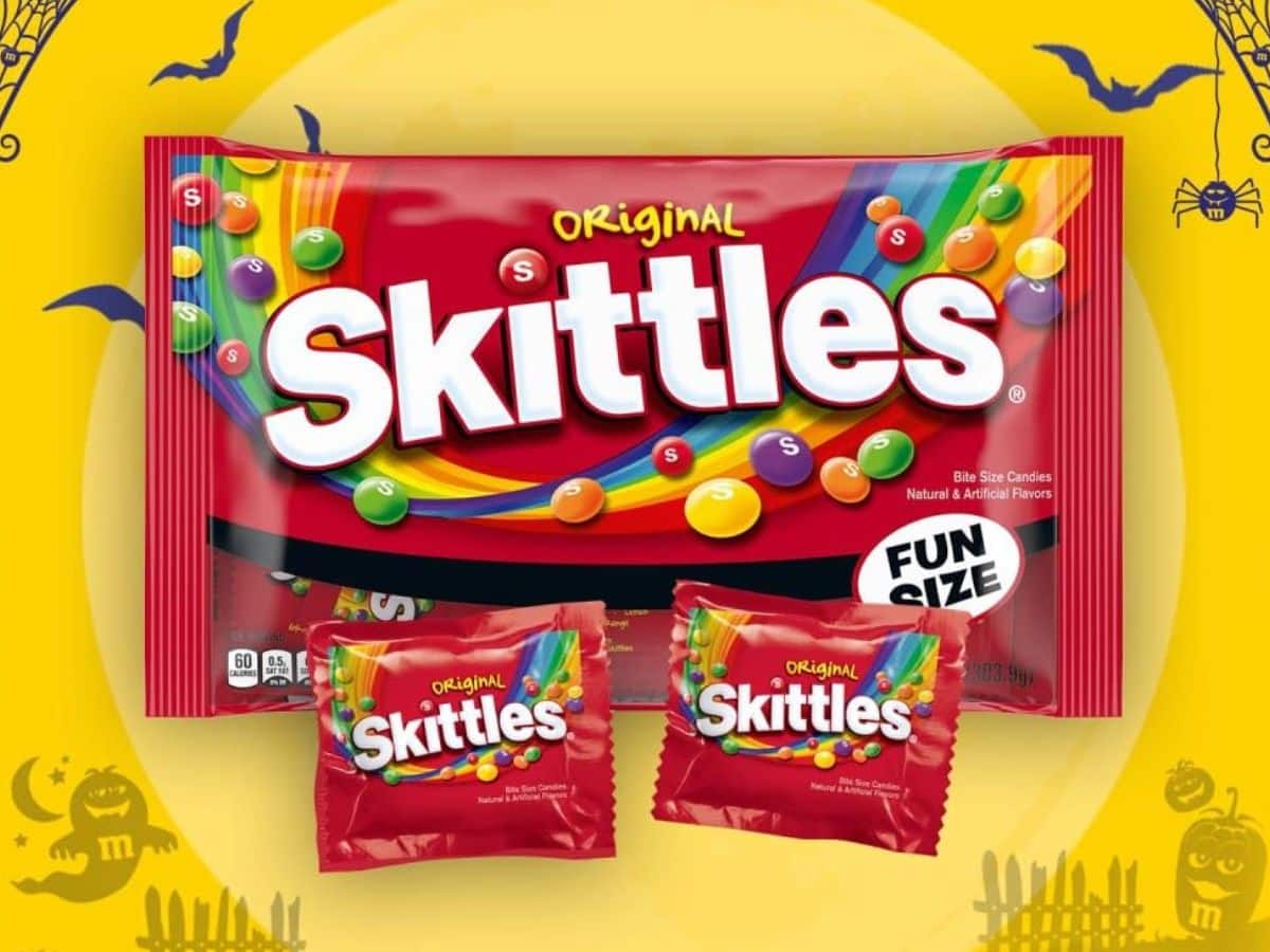 A fun size bag of skittles on a festive yellow background.