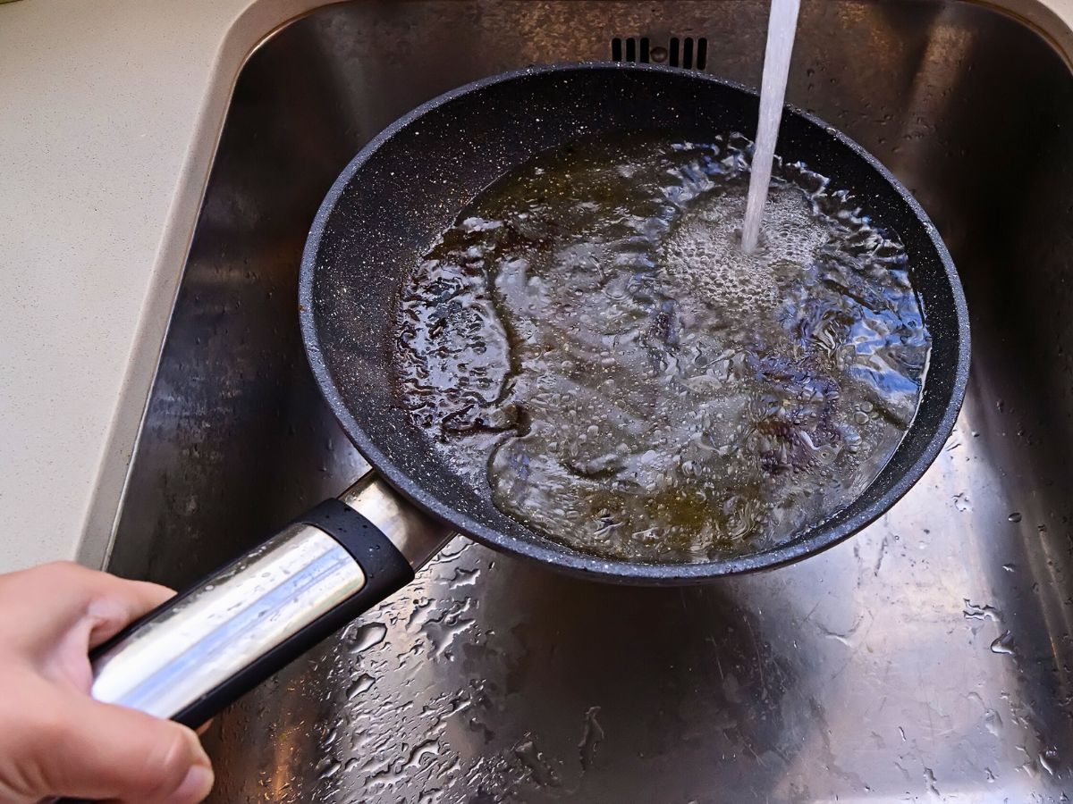To properly clean a cast iron skillet, first wash it.