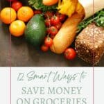 Assorted fresh vegetables and bread on a counter above text reading '12 Smart Ways to Save Money on Groceries' with the Sage AlphaGal logo.
