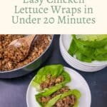 A bowl of cooked chicken mixture with a wooden spoon, plates of lettuce leaves, and two assembled lettuce wraps on a white plate.