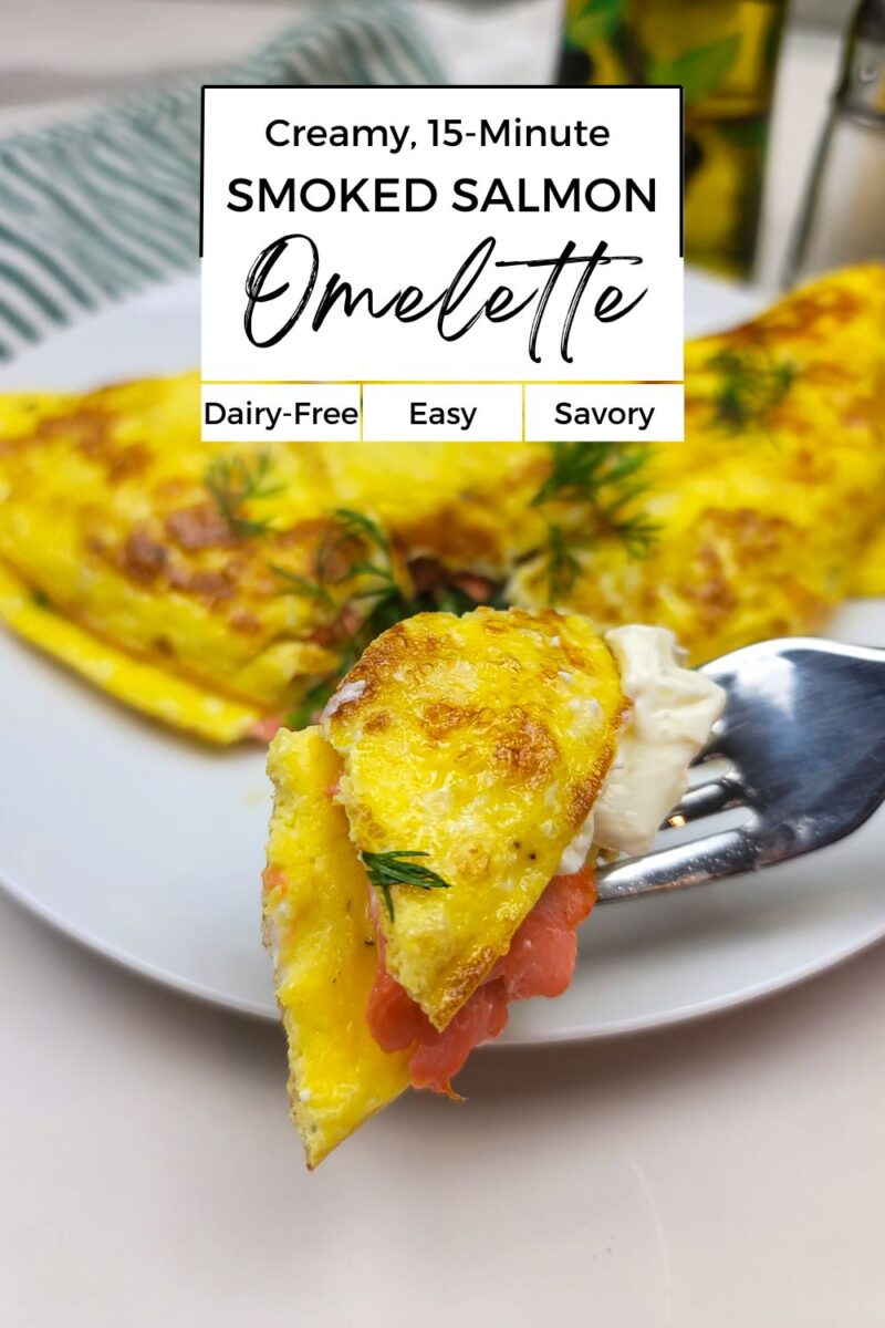 A fork holds a bite of smoked salmon omelette with fresh dill; a sliced omelette sits on a white plate behind it. Text overlay highlights it's dairy-free, easy, and savory.